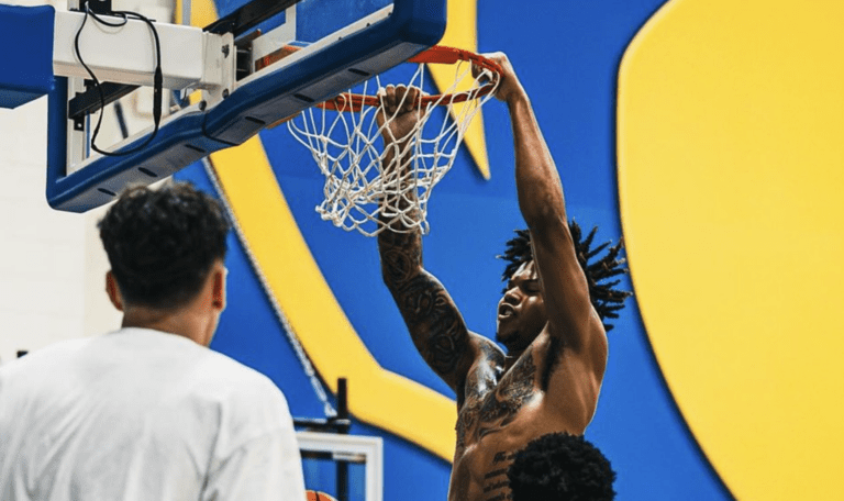 Cam Corhen dunks home a basketball at his new school, Pitt, after transferring from Florida State.